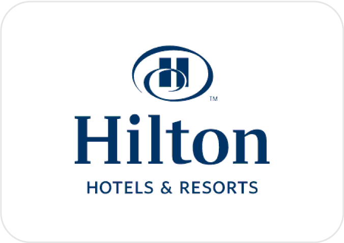 Hilton Hotels & Resorts logo featuring a stylized "H" within an oval above the brand name in dark blue text on a white background.