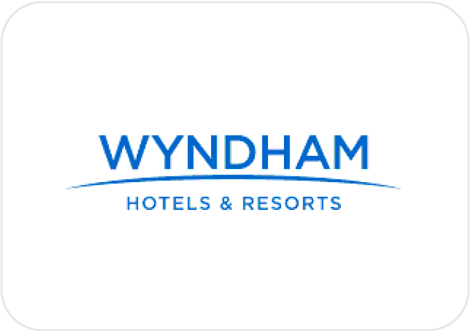 Logo of Wyndham Hotels & Resorts, featuring the company name in blue text on a white background.